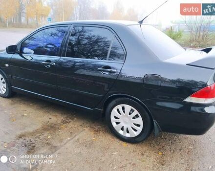 Мицубиси Лансер 2008 в Прилуках на Automoto.ua Черный Мицубиси Лансер, объемом двигателя 1.58 л и пробегом 219 тыс. км за 4900 $, фото 4 на Automoto.ua