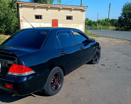 Чорний Міцубісі Lancer, об'ємом двигуна 1.6 л та пробігом 0 тис. км за 4200 $, фото 8 на Automoto.ua