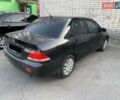 Черный Мицубиси Лансер, объемом двигателя 1.58 л и пробегом 250 тыс. км за 4900 $, фото 1 на Automoto.ua