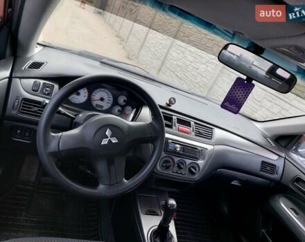 Чорний Міцубісі Lancer, об'ємом двигуна 1.6 л та пробігом 215 тис. км за 4900 $, фото 12 на Automoto.ua