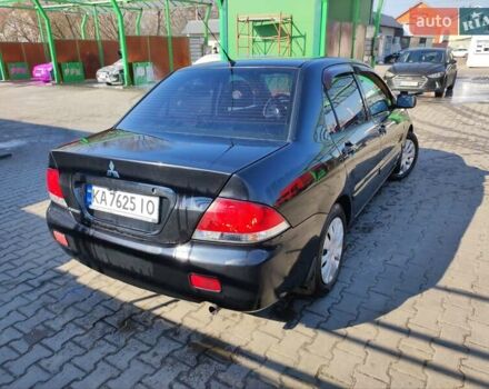 Чорний Міцубісі Lancer, об'ємом двигуна 1.6 л та пробігом 335 тис. км за 3100 $, фото 7 на Automoto.ua