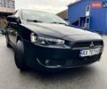 Чорний Міцубісі Lancer, об'ємом двигуна 2 л та пробігом 217 тис. км за 5800 $, фото 1 на Automoto.ua