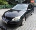 Черный Мицубиси Лансер, объемом двигателя 1.6 л и пробегом 380 тыс. км за 3500 $, фото 1 на Automoto.ua