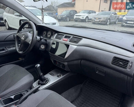 Черный Мицубиси Лансер, объемом двигателя 1.58 л и пробегом 202 тыс. км за 4100 $, фото 25 на Automoto.ua