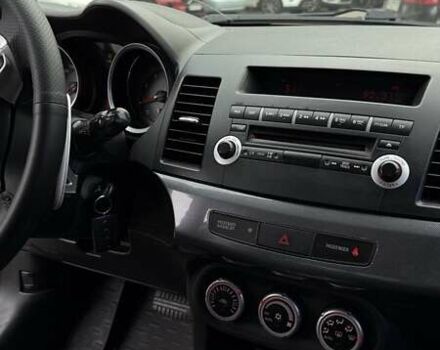 Черный Мицубиси Лансер, объемом двигателя 2 л и пробегом 222 тыс. км за 6000 $, фото 5 на Automoto.ua