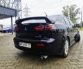 Черный Мицубиси Лансер, объемом двигателя 2 л и пробегом 240 тыс. км за 7450 $, фото 1 на Automoto.ua