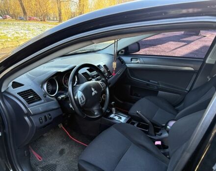 Черный Мицубиси Лансер, объемом двигателя 2 л и пробегом 236 тыс. км за 6550 $, фото 7 на Automoto.ua