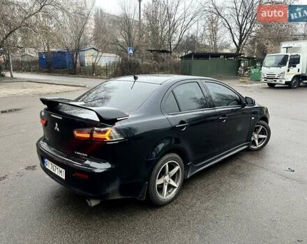 Черный Мицубиси Лансер, объемом двигателя 2 л и пробегом 217 тыс. км за 7000 $, фото 28 на Automoto.ua
