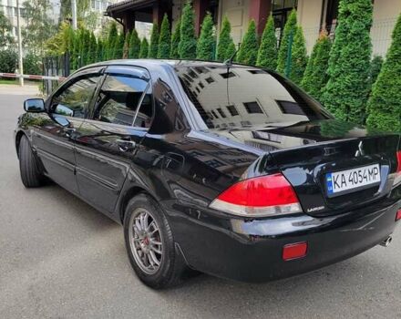 Чорний Міцубісі Lancer, об'ємом двигуна 1.58 л та пробігом 334 тис. км за 4750 $, фото 6 на Automoto.ua
