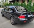 Чорний Міцубісі Lancer, об'ємом двигуна 1.58 л та пробігом 334 тис. км за 4750 $, фото 6 на Automoto.ua