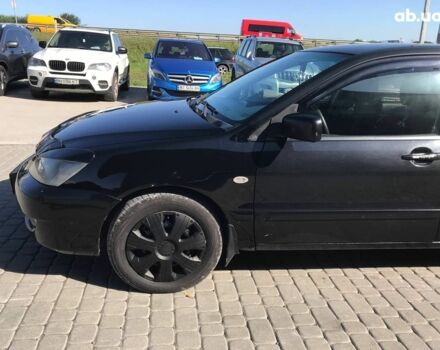 Черный Мицубиси Лансер, объемом двигателя 1.6 л и пробегом 356 тыс. км за 4590 $, фото 15 на Automoto.ua