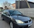 Черный Мицубиси Лансер, объемом двигателя 1.6 л и пробегом 225 тыс. км за 3400 $, фото 1 на Automoto.ua