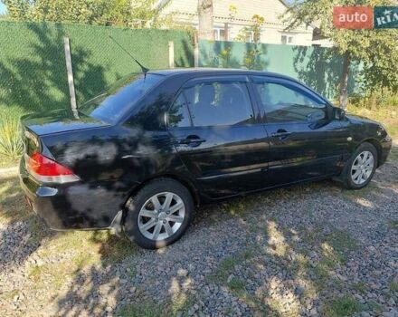Чорний Міцубісі Lancer, об'ємом двигуна 1.6 л та пробігом 221 тис. км за 5200 $, фото 6 на Automoto.ua
