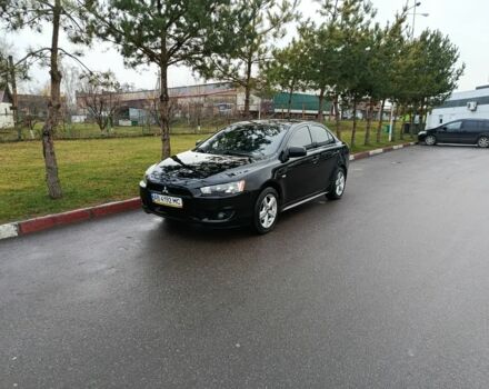 Черный Мицубиси Лансер, объемом двигателя 2 л и пробегом 200 тыс. км за 5100 $, фото 1 на Automoto.ua