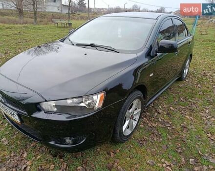Черный Мицубиси Лансер, объемом двигателя 2 л и пробегом 200 тыс. км за 5100 $, фото 1 на Automoto.ua