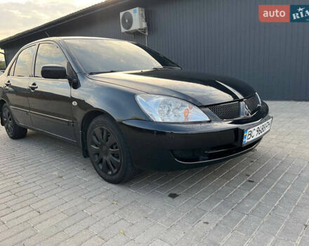 Чорний Міцубісі Lancer, об'ємом двигуна 1.58 л та пробігом 237 тис. км за 4500 $, фото 11 на Automoto.ua