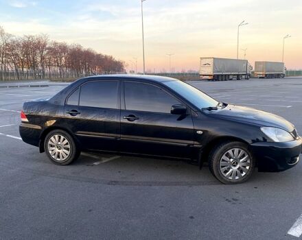 Чорний Міцубісі Lancer, об'ємом двигуна 1.6 л та пробігом 375 тис. км за 4899 $, фото 3 на Automoto.ua