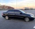 Чорний Міцубісі Lancer, об'ємом двигуна 1.6 л та пробігом 375 тис. км за 4899 $, фото 3 на Automoto.ua