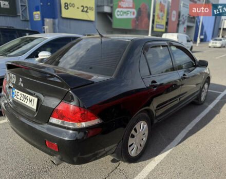 Чорний Міцубісі Lancer, об'ємом двигуна 1.58 л та пробігом 227 тис. км за 5300 $, фото 4 на Automoto.ua