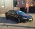 Черный Мицубиси Лансер, объемом двигателя 2 л и пробегом 85 тыс. км за 6500 $, фото 10 на Automoto.ua