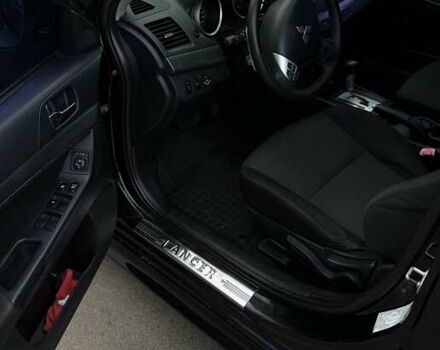 Черный Мицубиси Лансер, объемом двигателя 2 л и пробегом 222 тыс. км за 6000 $, фото 11 на Automoto.ua