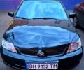 Чорний Міцубісі Lancer, об'ємом двигуна 1.6 л та пробігом 205 тис. км за 5500 $, фото 1 на Automoto.ua