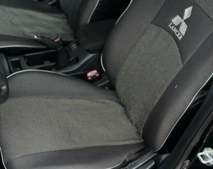 Чорний Міцубісі Lancer, об'ємом двигуна 1.5 л та пробігом 111 тис. км за 6999 $, фото 41 на Automoto.ua