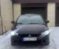 Черный Мицубиси Лансер, объемом двигателя 2 л и пробегом 225 тыс. км за 7000 $, фото 1 на Automoto.ua