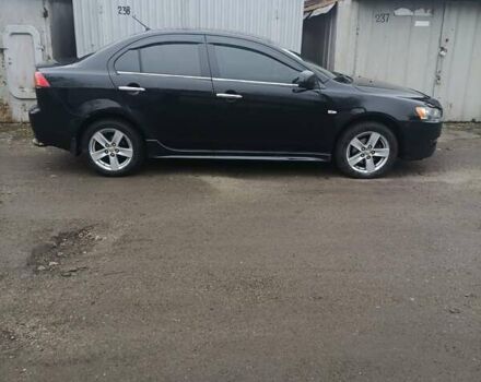 Черный Мицубиси Лансер, объемом двигателя 2 л и пробегом 192 тыс. км за 6350 $, фото 1 на Automoto.ua