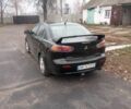 Чорний Міцубісі Lancer, об'ємом двигуна 2 л та пробігом 232 тис. км за 5000 $, фото 7 на Automoto.ua