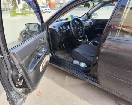 Черный Мицубиси Лансер, объемом двигателя 1.6 л и пробегом 358 тыс. км за 4300 $, фото 7 на Automoto.ua