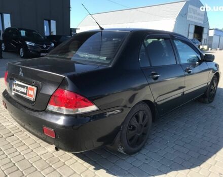 Черный Мицубиси Лансер, объемом двигателя 1.6 л и пробегом 356 тыс. км за 4590 $, фото 10 на Automoto.ua