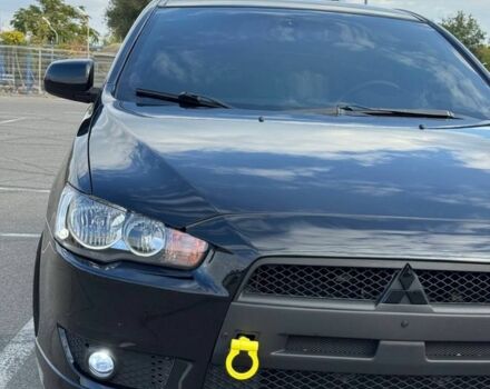 Черный Мицубиси Лансер, объемом двигателя 2 л и пробегом 297 тыс. км за 7500 $, фото 1 на Automoto.ua