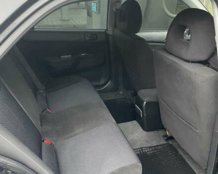 Черный Мицубиси Лансер, объемом двигателя 1.58 л и пробегом 214 тыс. км за 4400 $, фото 17 на Automoto.ua