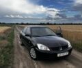 Чорний Міцубісі Lancer, об'ємом двигуна 1.6 л та пробігом 589 тис. км за 4124 $, фото 1 на Automoto.ua