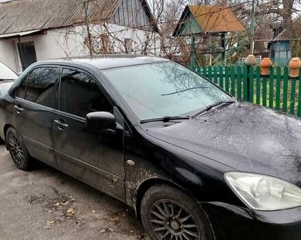 Черный Мицубиси Лансер, объемом двигателя 1.6 л и пробегом 126 тыс. км за 4500 $, фото 3 на Automoto.ua