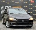 Чорний Міцубісі Lancer, об'ємом двигуна 2 л та пробігом 118 тис. км за 6200 $, фото 1 на Automoto.ua