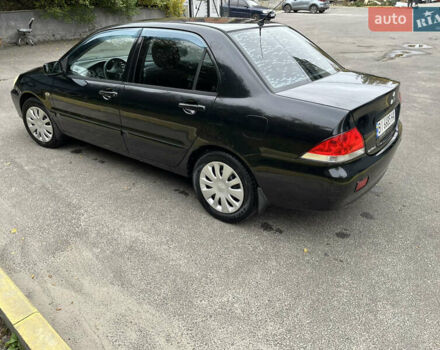 Чорний Міцубісі Lancer, об'ємом двигуна 1.58 л та пробігом 192 тис. км за 4500 $, фото 4 на Automoto.ua
