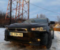 Чорний Міцубісі Lancer, об'ємом двигуна 2 л та пробігом 175 тис. км за 7999 $, фото 1 на Automoto.ua