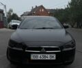 Черный Мицубиси Лансер, объемом двигателя 2 л и пробегом 127 тыс. км за 6200 $, фото 1 на Automoto.ua