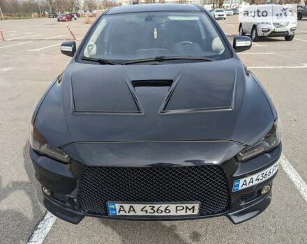 Черный Мицубиси Лансер, объемом двигателя 2 л и пробегом 240 тыс. км за 10000 $, фото 2 на Automoto.ua