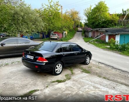 Чорний Міцубісі Lancer, об'ємом двигуна 1.6 л та пробігом 190 тис. км за 3950 $, фото 4 на Automoto.ua