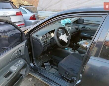 Черный Мицубиси Лансер, объемом двигателя 1.6 л и пробегом 200 тыс. км за 2000 $, фото 8 на Automoto.ua