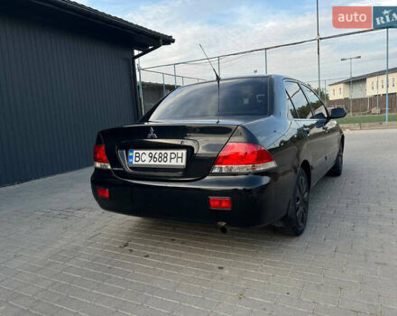 Чорний Міцубісі Lancer, об'ємом двигуна 1.58 л та пробігом 237 тис. км за 4500 $, фото 7 на Automoto.ua