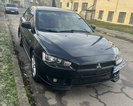 Черный Мицубиси Лансер, объемом двигателя 2 л и пробегом 270 тыс. км за 5400 $, фото 1 на Automoto.ua