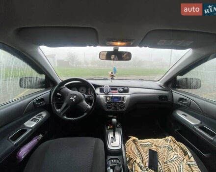 Черный Мицубиси Лансер, объемом двигателя 1.58 л и пробегом 211 тыс. км за 6333 $, фото 31 на Automoto.ua