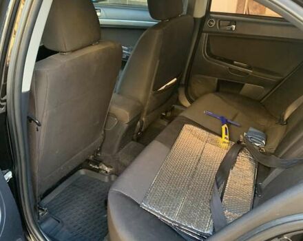 Черный Мицубиси Лансер, объемом двигателя 2 л и пробегом 210 тыс. км за 7000 $, фото 3 на Automoto.ua