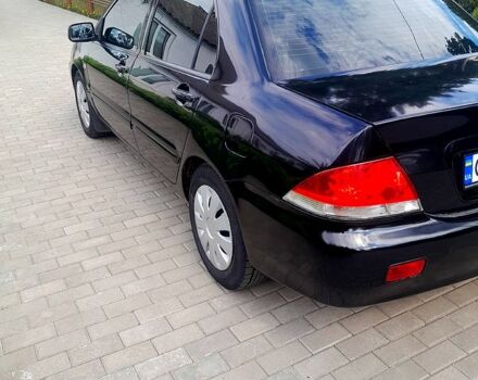 Черный Мицубиси Лансер, объемом двигателя 1.6 л и пробегом 206 тыс. км за 4200 $, фото 2 на Automoto.ua