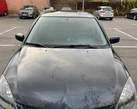 Чорний Міцубісі Lancer, об'ємом двигуна 1.6 л та пробігом 245 тис. км за 4500 $, фото 1 на Automoto.ua