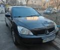 Черный Мицубиси Лансер, объемом двигателя 1.6 л и пробегом 192 тыс. км за 4000 $, фото 1 на Automoto.ua